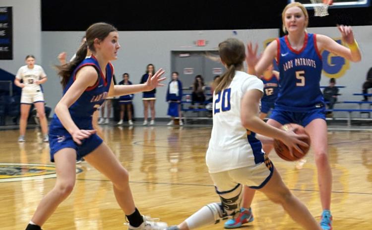 DOUBLE-TEAM Valley’s Cruse Paisley (left) and Allie Pigg (5) trap a Spur player in the Lady Patriots’ district win January 17. | SUE JANE SULLIVAN