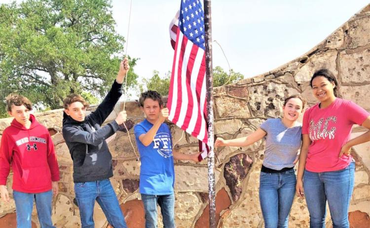 MOTLEY MEMORIAL FFA members Trent Barclay, Trevor Barclay, Matthew Hutchinson, Bailea Lawrence and Jada Richards helped honor those who served on Memorial Day by replacing service crosses and placing flags to recognize veterans. | JIM COOPER PHOTO