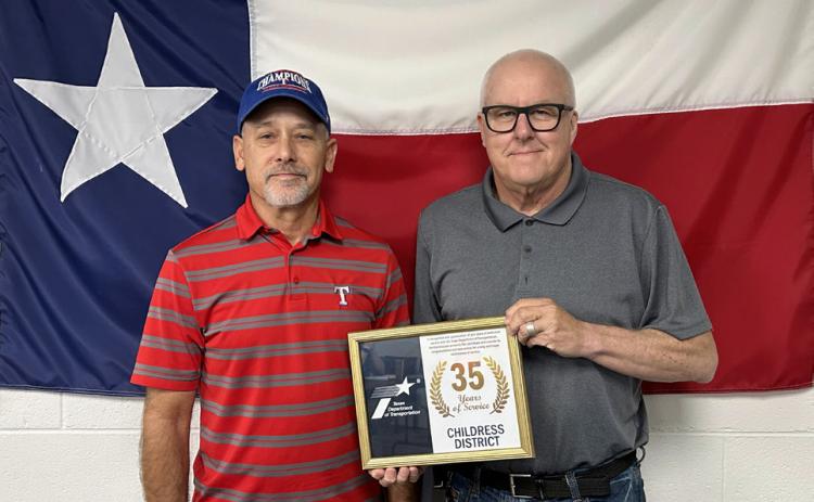 DARRELL REYNOLDS, Briscoe County maintenance, left, accepts his 35 years of service award from Childress District Engineer Darwin Lankford. | TxDOT PHOTO