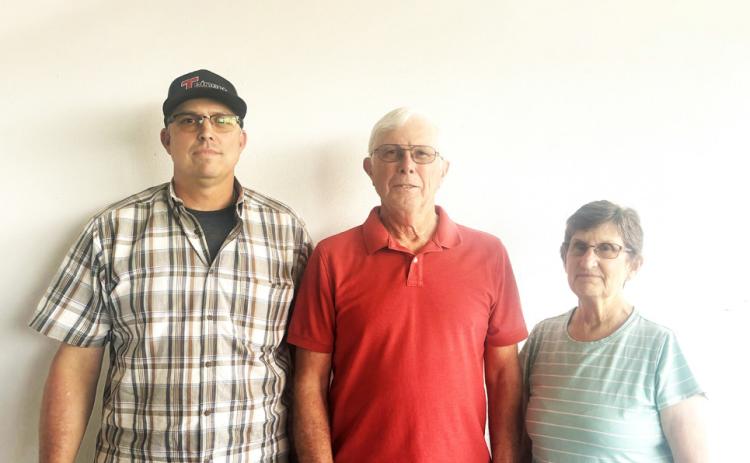 NEW OWNER JoDee Robison (left)—pictured with previous owners and bosses Anthony Kingery and Kathy Kingery—is the new owner of D and K Manufacturing of Silverton. The company, which began in 1976, manufactures irrigation equipment in addition to doing welding and machine work, and Robison has worked as an employee there for 30 years. | COURTESY PHOTO