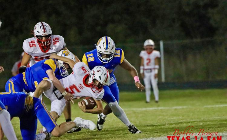 SLAYTON CAGLE POWERS THROUGH the Bulldog defensive line, looking for a first-down in the matchup against Spur on Friday, Oct. 10. | COURTESY PHOTO BY TEXAS 1A FAN