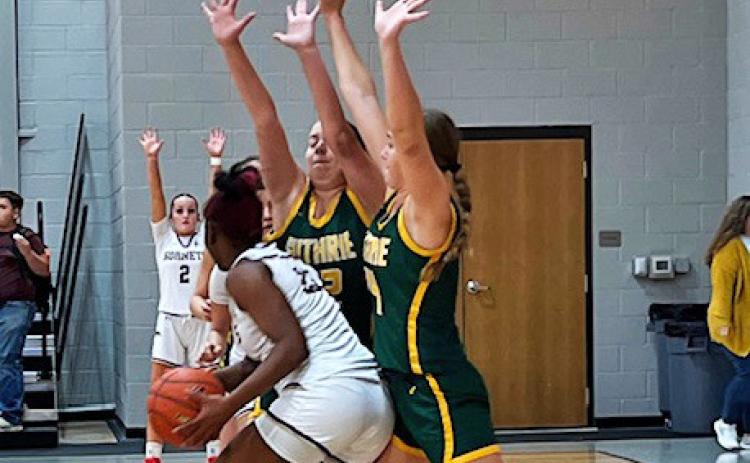 Guthrie defenders Sierra Jones and Lou Bonaventure set up a wall against Harrold during the Rotan Tournament. | CAPROCK COURIER