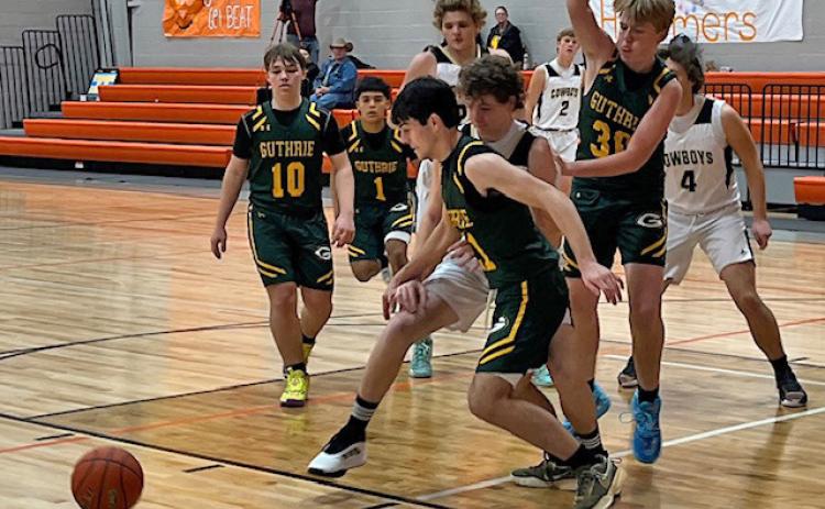 Jaguars Scrappy Trevino (10), Steven Uribe (1), Zane Moore (21) and Clay Hodges (30) teamed up on defense against the Woodson Cowboys at the Rotan Tournament last weekend. | CAPROCK COURIER