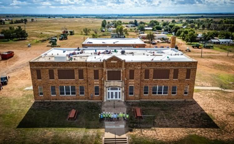 UP ON A ROOF Construction crews from Texas Roofing and Jason Milliken ensured that the Bob Wills Center got a badley needed new roof last year. | COURTESY PHOTO