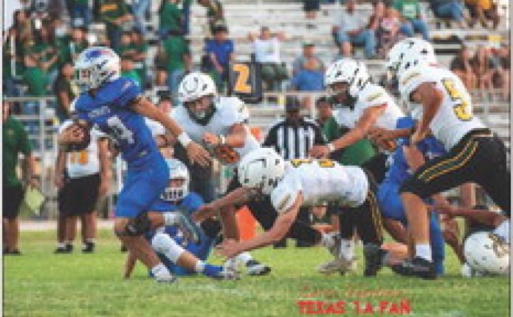 VALLEY FALLS Senior Brayson Cruse #14 breaks through the line in the Valley football game Friday night. The Patriots lost to Springlake-Earth 46-21. | TEXAS 1A FAN