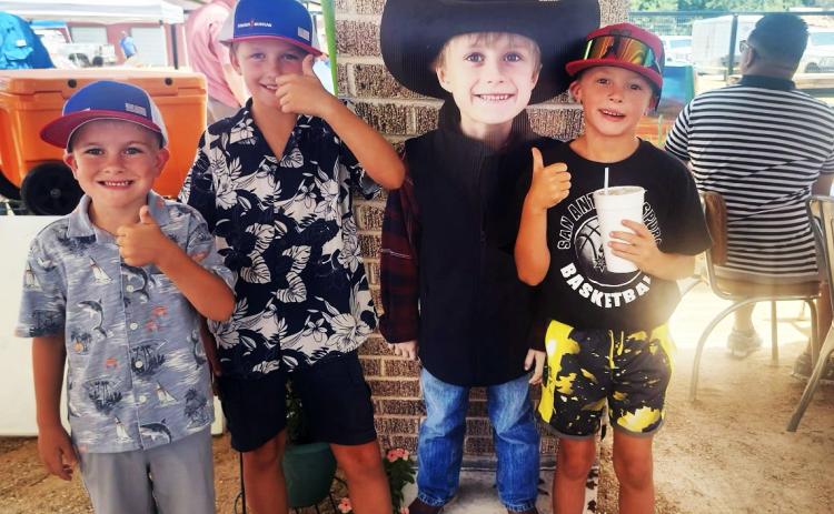 MATADOR GENEROSITY Volunteers donated the time and treasures in auctions, cornhole tournament, meals and music in a fundraiser July 13 for Paxton Barclay, who is being treated for a rare brain tumor. | COURTESY PHOTOS