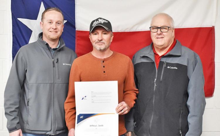 QUARTER OF A CENTURY Briscoe County maintenance supervisor Jeff Smith, center, was presented with an award for his 25 years of service to the Childress District of the Texas Department of Transportation on Wednesday, Jan. 5 in Childress. Childress area engineer Matt Herbstritt, P.E., and Childress district engineer Darwin Lankford, P.E., are also pictured.