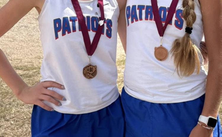 LADY PATRIOT MEDALISTS Paisley Cruse and Hartlee Battey both won medals, placing in the top ten at the Clarendon Lake Greenbelt Run cross country meet onTuesday, Sept 16. | COURTESY PHOTO