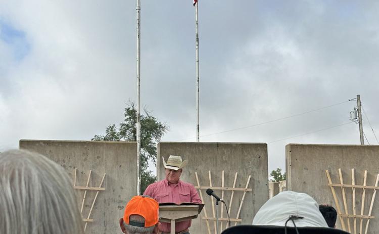 PATRIOTIC PRIDE Though attendance may have been slight at the Roaring Springs memorial last Friday morning, patriotic sentiment—led by veteran and Motley County Sheriff Robert Fisk—ran high. | TINA BROOKS PHOTO