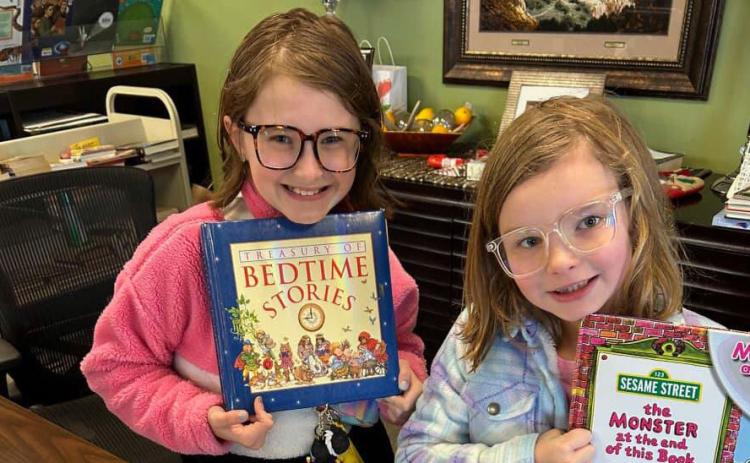 SILVERTON LIBRARY A couple of cheerful visitors spent time at the Silverton Library during the Christmas break. Normal business hours return Tuesday, Jan. 2, 10 a.m. to 4 p.m., and the preschool reading time will resume the following week, Monday, Jan. 8. | COURTESY PHOTO