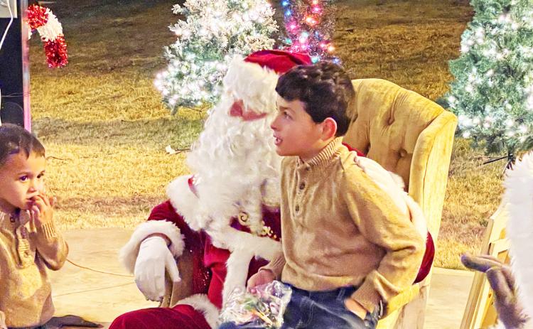 MAGIC IN MATADOR The magic of the Christmas season came to Matador last week with special holiday events all Thursday evening, including a lighted Christmas parade, the Grinch and other Seuss characters at the library, special shopping all night long, and Santa and Mrs. Claus welcoming children at the courthouse gazebo. | CAPROCK COURIER PHOTO