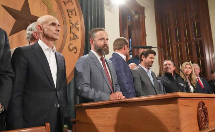REP. DUSTIN BURROWS (R-Lubbock), center, at lectern, made a power play last weekend for leadership of the Texas House of Representatives; matters were still very much up in the air at newspaper press times. | TEXAS TRIBUNE