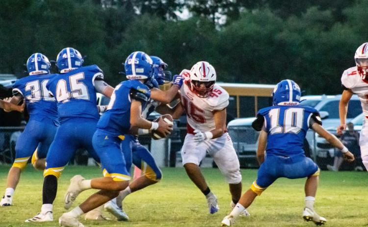 ONAQBHUNT Owl Cain Narvaez finds a hole in the Swift defense, hunting for a sack on the quarterback during Friday night’s game against Nazareth. | KODIE FAIRCHILD