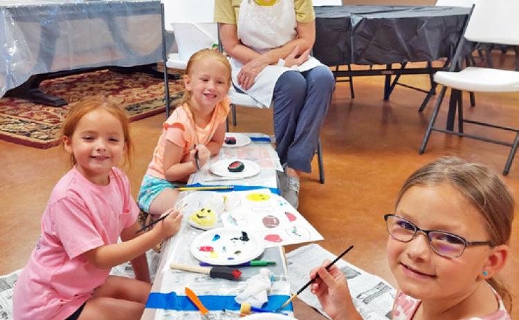 SILVERTON SUMMER READING Blaire Beedy, Jewel Cogdell, and Grace Estes were just a few of the many youngsters who painted kindness rocks, hosted by Kathy May at the Silverton Library. | COURTESY PHOTO