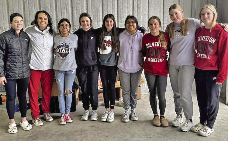 HELPING OUT The Silverton girls basketball team helped out last week with High Plains Food Bank distribution atTri-County Meals in Quitaque. | COURTESY PHOTOS