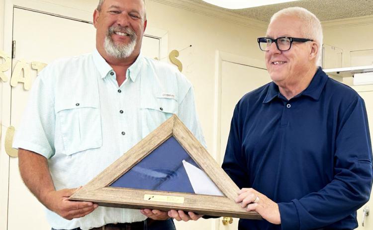 COTTLE RETIREMENT Last week marked the end of Ron Gilbert’s 26-plus-year career with theTexas Department ofTransportation, with has last 15 years spent as the Cottle County maintenance supervior. He was presented a Texas flag by District Engineer Darwin Lankford. | TxDOT PHOTO
