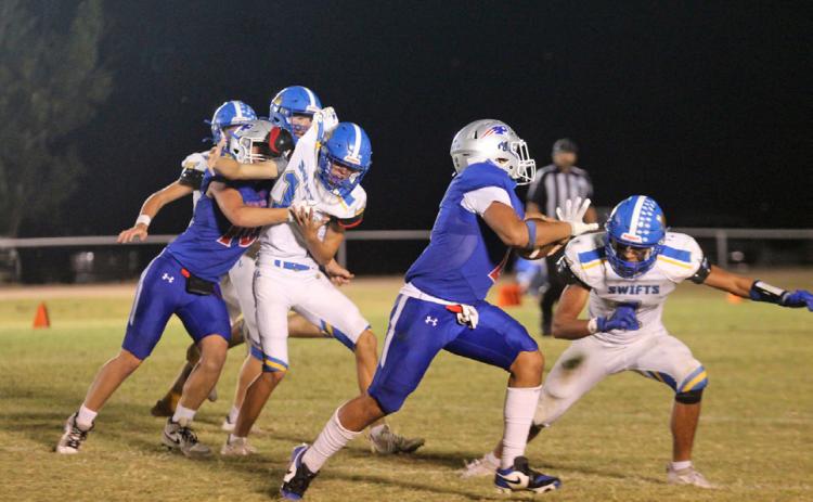 ABLOCKANDARUN Tripp Carlisle lands a solid block for Damian Valdes as he runs for a touchdown against the Nazareth Swifts. | COURTESY VALLEY YEARBOOK