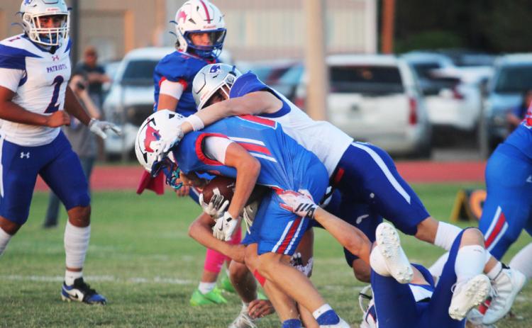 CARSONTUCKER DOWNS A MUSTANG in the game at Claude on Friday, Oct. 3. | COURTESY PHOTO BY VALLEY YEARBOOK
