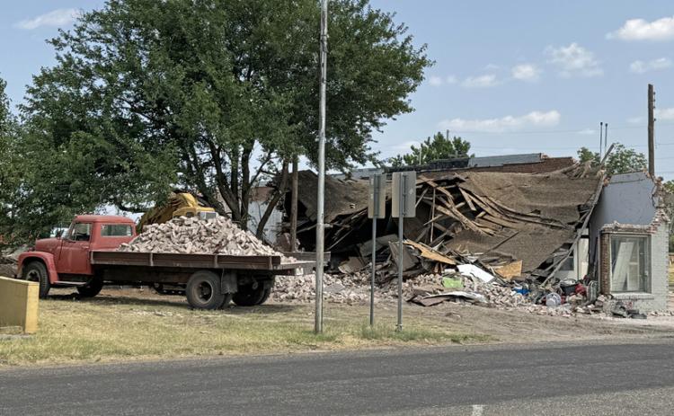 DEMOLITION on the old gas station at Main and Bailey is continuing: above left, in November 2023; right, last week. | CAPROCK COURIER PHOTOS