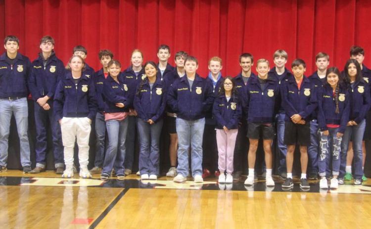 Motley County FFA members were presented their blue and gold corduroy FFA jackets Tuesday morning by adviser Jim Cooper, Coach Mike Bigham, Chapter President Harlee Hill, and District officer Brooklyn Freeman. | COURTESY PHOTO