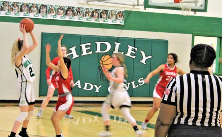 PLAYOFF BOUND The Silverton Lady Owls, shown here in last week’s victory over Hedley, have qualified for the playoffs, even though they dropped a game Friday night, losing to Claude 41–27. | COURTESY PHOTO
