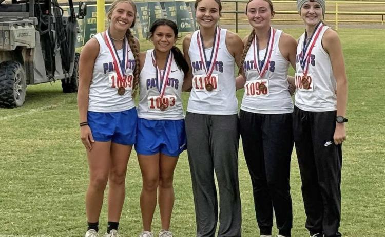 THE LADY PATRIOTS are Regional bound after placing third as a team at their district cross country meet in Guthrie Oct. 8. | COURTESY PHOTO