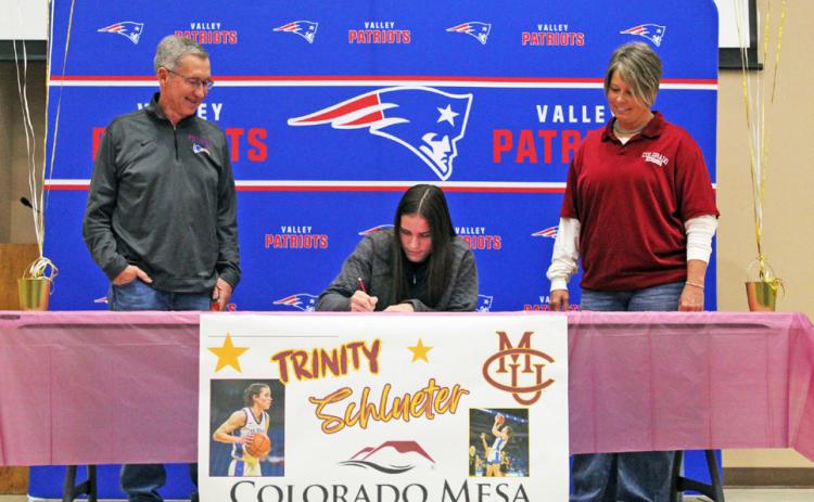 LETTER OF INTENT Valley High School’sTrinity Schlueter (middle) signed a letter of intent to play college basketball for Colorado Mesa University. | COURTESY PHOTO