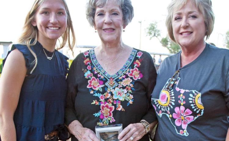 A SMITH LEGACY Honored with a special buckle award before Saturday night’s rodeo events as a longtime event supporter was Bonnie Edwards of Spur (center), herself a former rodeo queen. | THE TEXAS SPUR