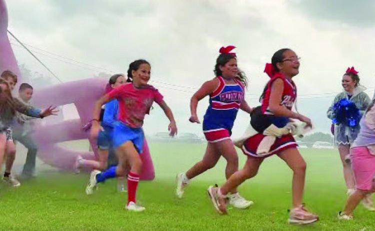 NEW TRADITION AT VALLEY Tradition is alive at Valley School as they formed their first ever Patriot Platoon on Friday, Sept. 5. The platoon, made up of elementary students, will be ready to run through the helmet with the Patriots at every home game this year. | COURTESY PHOTO
