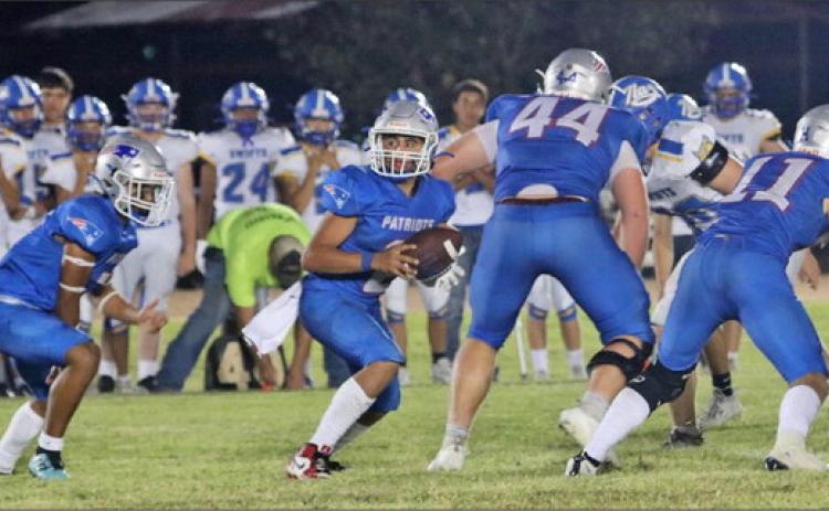 WALL OF BLOCKERS Seniors Tucker Schlueter, #44, and Cash Sperry, #11, set up the run with blocking. | COURTESY PHOTO